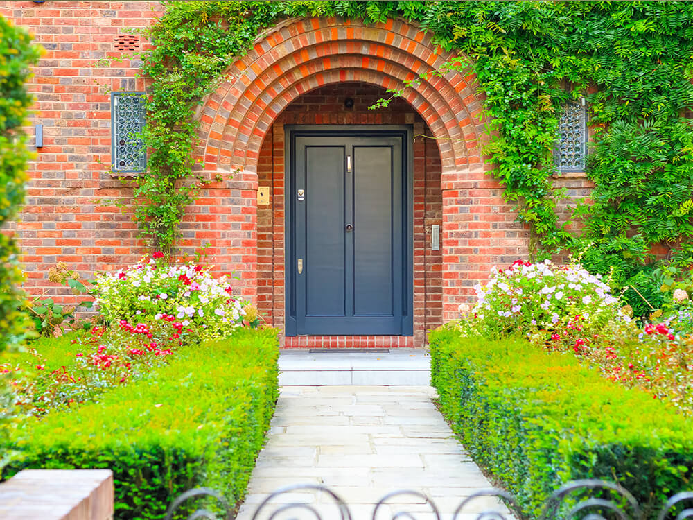 Front Door Cottage Decorated With Garden Plants And Flowers IBD-246795